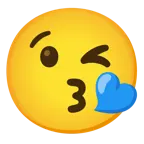 face blowing a kiss + blue heart