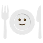 slightly smiling face + fork and knife with plate