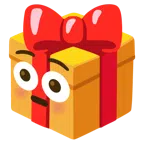 Geschenk + errötetes Gesicht mit großen Augen