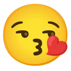 face blowing a kiss + smirking face