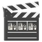 Filmklappe + Sonnenuntergang in der Stadt