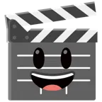 film tahtası + ağzı açık sırıtma
