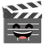 film tahtası + gülen gözlerle ağzı açık sırıtma