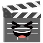 film tahtası + kapalı gözlerle ağzı açık sırıtma