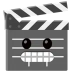 film tahtası + dişlerini gösteren yüz