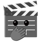 film tahtası + gözleri açık ve eliyle ağzını kapatan yüz