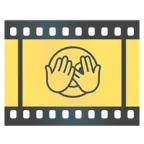 Filmstreifen + Gesicht mit durch die Finger linsendem Auge
